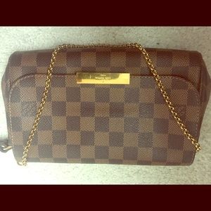 100 % authentic LV clutch/ crossbody